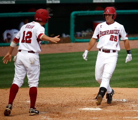 Arkansas Democrat-Gazette/JASON IVESTER - 05/21/11 - Arkansas' Collin Kuhn is congratulated by teammate Bo Bigham after hitting a two-run home run which scored the pair in the third inning against Ole Miss during the second game on Saturday, May 21, 2011, at Baum Stadium in Fayetteville.