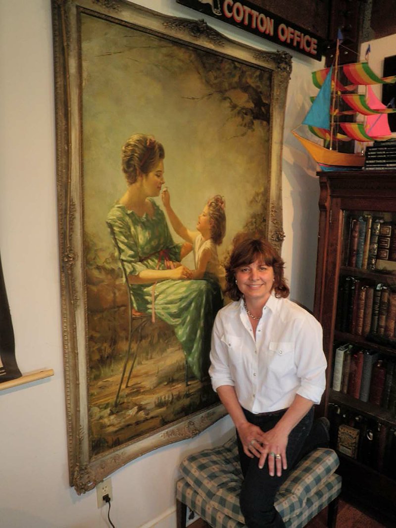 Norwood Creech is pictured in her home outside Lepanto with a 
portrait of herself and her mother painted by her grandmother.