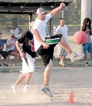Player Chad Brunt kicks the ball during a 2010 Adult Kickball League game. The league will kick off its third season in July in Hot Springs.