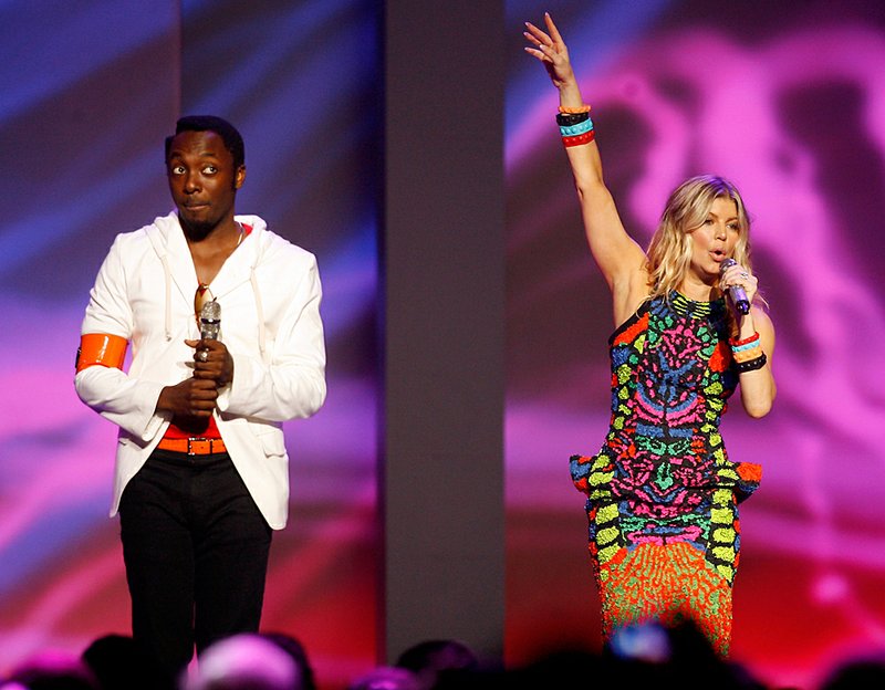 Black Eyed Peas members will.i.am (left) and Fergie perform Friday during the Wal-Mart shareholders meeting in Fayetteville. 