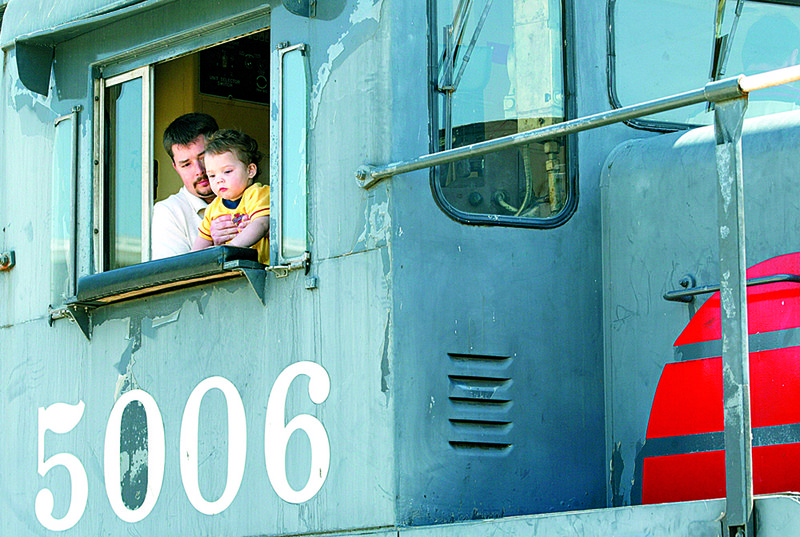 A father and son in Pine Bluff look out the conductor’s window of
a diesel locomotive at the Arkansas Railroad Museum, included
in the Arkansas Department of Parks and Tourism’s favorite-attractions
voting.