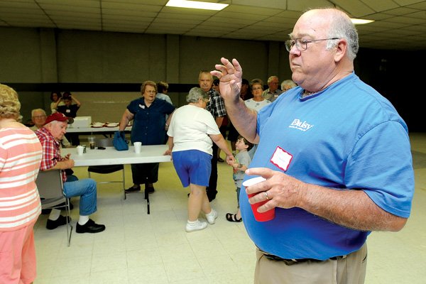 Jack Chandler of Washburn, Mo., talks Saturday about making memories at Daisy Manufacturing during the annual picnic reunion for employees at the Daisy Event Center at Lake Atalanta in Rogers. The company is celebrating its 125th anniversary this year.