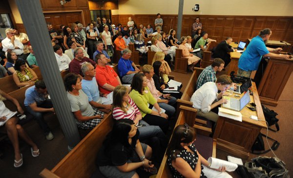 A large crowd fills the council chambers during a meeting of the Fayetteville City Council Tuesday, June 7, 2011, during which the council failed to pass an amendment to the city's current smoking ordinance to remove the exemption made for bars.