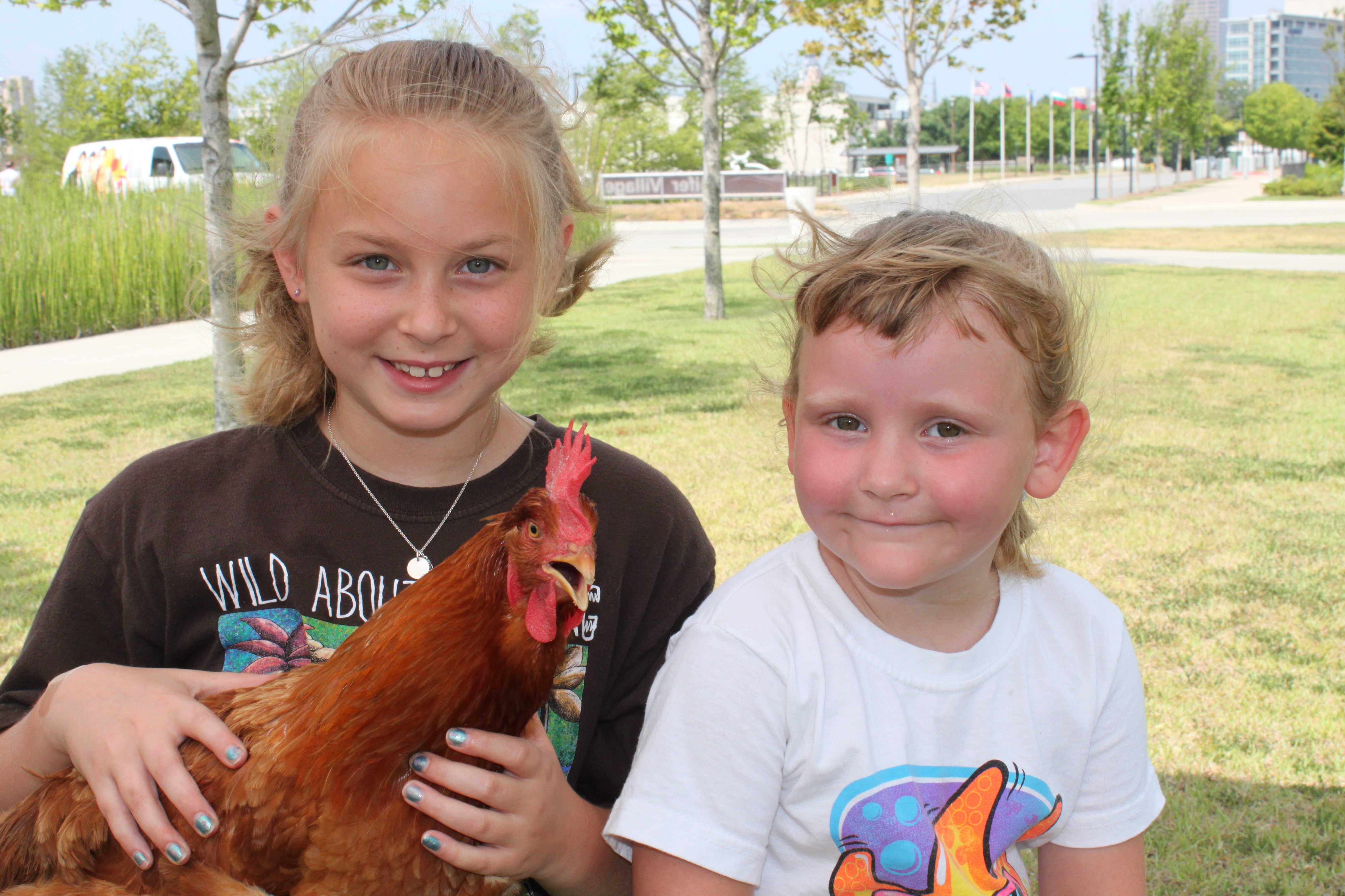 Lydia Maher and Skylar West hold a chicken