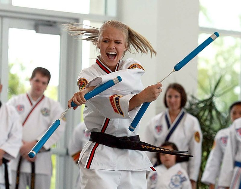 Heather Bolick of Little Rock demonstrates her ability with nunchucks during a previous American Taekwondo Association World Championship. 