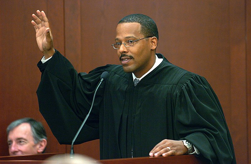 The newest United States District Judge of the Eastern District of Arkansas Brian S. Miller, who is from Helena, asks those in attendance for a show of hands if they are from Phillips County, where Helena is located, because of the large turn out Friday to witness his Investiture at the Little Rock federal building.