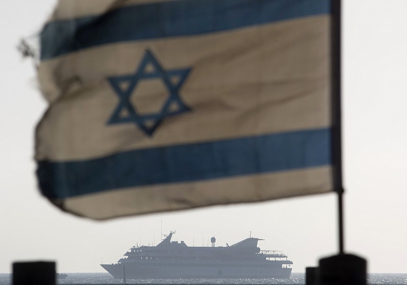 FILE - In this May 31, 2010 file photo the Mavi Marmara ship, the lead boat of a flotilla headed to the Gaza Strip which was stormed by Israeli naval commandos in a predawn confrontation, sails into the port of Ashdod, Israel. Israel on Sunday, June 26, 2011, threatened to ban international journalists for up to a decade from the country if they join a flotilla planning to breach the Israeli blockade of the Gaza Strip.