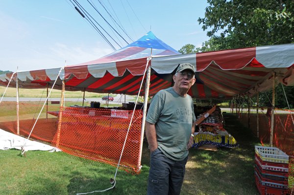  John Murphy opens the family fireworks stand in the front yard of his home on U.S. 71 between Greenland and West Fork earlier this week. The family has operated a stand at the site since the early 1980s. Murphy said Independence Day is his favorite holiday because it has always had special meaning to his family.
