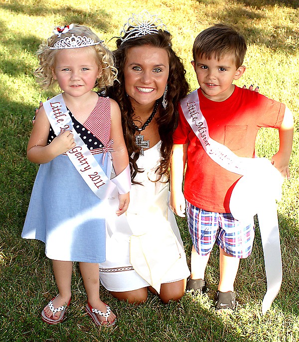 Winners of the Miss Tiny Tot and Mister Tiny Tot pageants, Raley Dilbeck and Cole Beaver, both 3, pose for a photo with reigning Miss Gentry, Courtney Millsap.