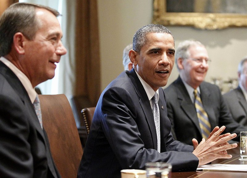 President Barack Obama meets with Senate Minority Leader Mitch McConnell (right) and other lawmakers Wednesday at the White House before walking out on the debt talks. 