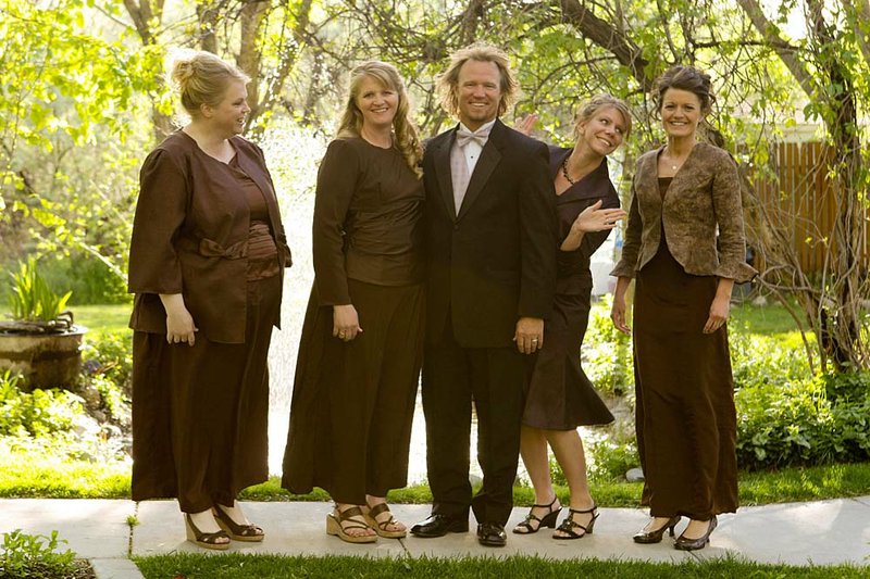  FILE - In this undated file photo provided by TLC, Kody Brown, center, poses with his wives, from left, Janelle, Christine, Meri, and Robyn in a promotional photo for TLC's reality TV show, "Sister Wives." 