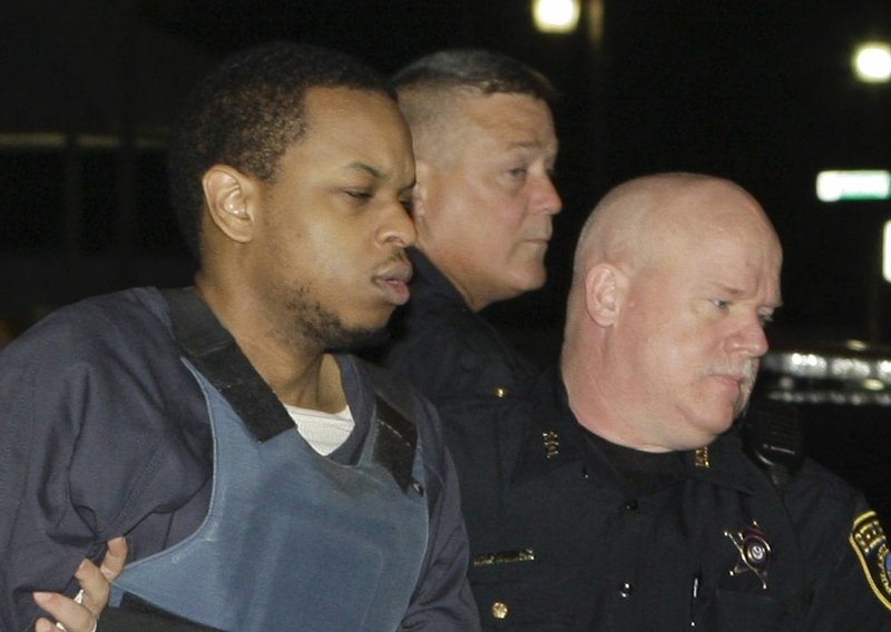 FILE — Abdulhakim Muhammad is escorted to the Pulaski County Courthouse in Little Rock, Ark., Friday, July 22, 2011, before the fifth day of his trial for the 2009 shooting death of a soldier and wounding of another outside a Little Rock recruiting center. 