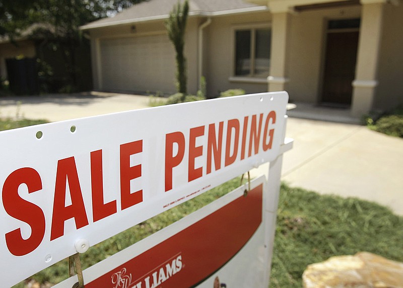 In this July 13, 2011 photo, a pending sale sign is displayed in front of a home in Little Rock. (AP/Danny Johnston)