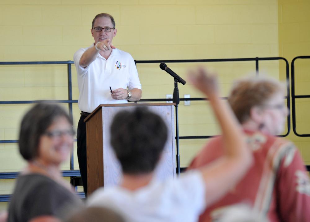 Arkansas Democrat-Gazette/MICHAEL WOODS  --08/02/11--Alan Wilbourn, Public Information Officer with the Fayetteville Public Schools introduces all the new teachers to the Fayetteville School District Tuesday afternoon at the new Happy Hollow Elementary School in Fayetteville during a lunch for the new teachers sponsored by the Rotary Club.