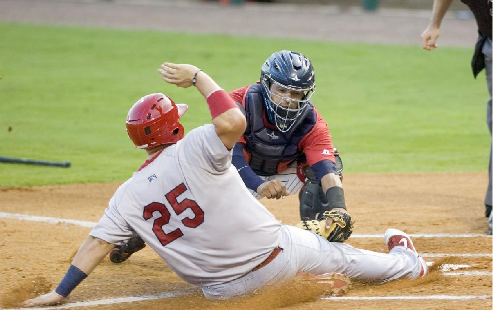 Arkansas Democrat-Gazette/KAREN E. SEGRAVE
8/2/11

Arkansas' catcher Orlando Mercado (facing) waits with the ball to tag Springfield's Matt Adams out at home plate in the bottom of the first inning Tuesday night.