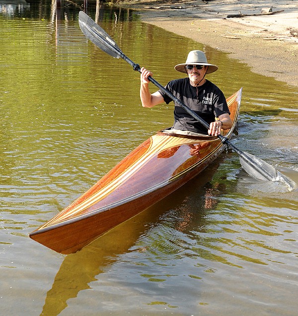 Doug Powell’s hybrid boat hits the water for the first time at the town of Beaver on the White River. He built the kayak using the “stitch and glue” method and a strip planking process.