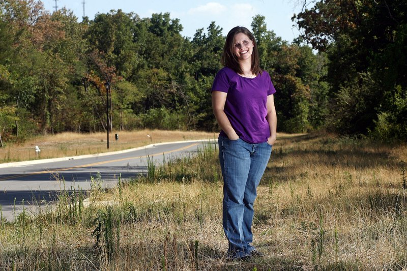 Jen Carlson, outreach coordinator for the Northwest Arkansas Women’s Shelter, likes a spot in the road on her daily run where she says the city turns rural.