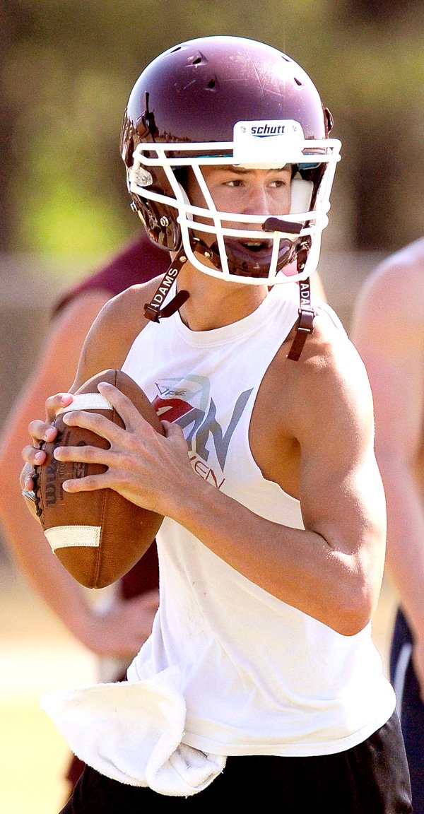 Gentry senior quarterback Dylan Ochs looks to pass Wednesday, Aug. 3, during the Pioneers' practice in Gentry.
