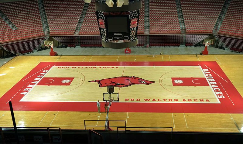 A larger Razorbacks logo, a lighter background and no-charge zones are some of the changes to the court at Bud Walton Arena this season. 