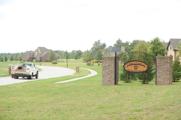 A truck passes south into The Estates at Salem Hills on West Howard Nickell Road on Tuesday in Fayetteville. The road is planned for expansion into a four-lane arterial road, though, the city Planning Commission recommended having it continue its designation as a two-lane collector street.