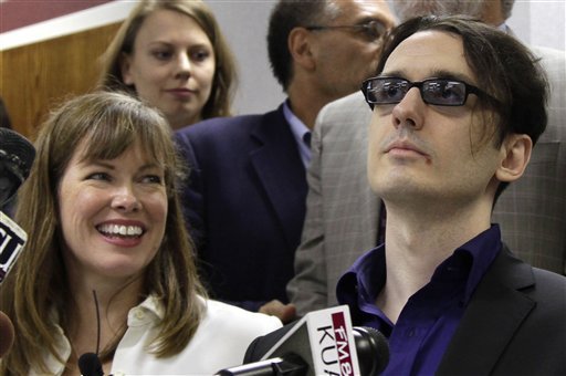 Damien Echols, right, and his wife Lorri attend a news conference at the Craighead County Court House in Jonesboro, Ark., Friday, Aug. 19, 2011, after Echols and two other men entered guilty pleas to to crimes they say they did not commit in order to be set free. The defendants, known by their supporters as the West Memphis 3, agreed to a legal maneuver that lets them maintain their innocence while acknowledging prosecutors have enough evidence against them.