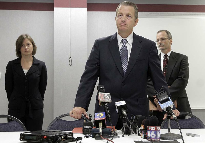  
Scott Ellington, center, prosecuting attorney second judicial district, flanked by prosecutors Melonie Osworth and Alan Copelin, discussed the terms of a deal struck by the state releasing three men convicted of the 1993 deaths of three West Memphis children.  Damien Echols, Jessie Misskelley and Jason Baldwin agreed to a legal maneuver that lets them maintain their innocence while acknowledging prosecutors have enough evidence against them.