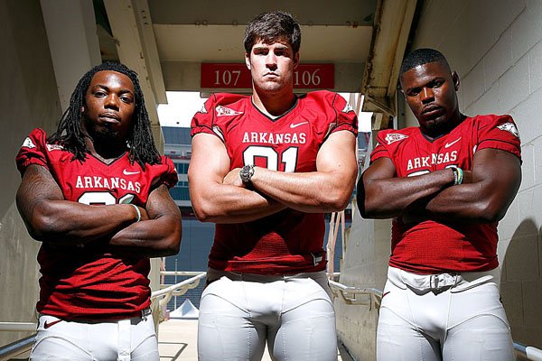 In this photo taken Sept. 3, 2011, Arkansas defensive end Jake Bequette  adjusts his helmet during the NCAA college football game against Missouri  State in Fayetteville, Ark. Arkansas expects a step up