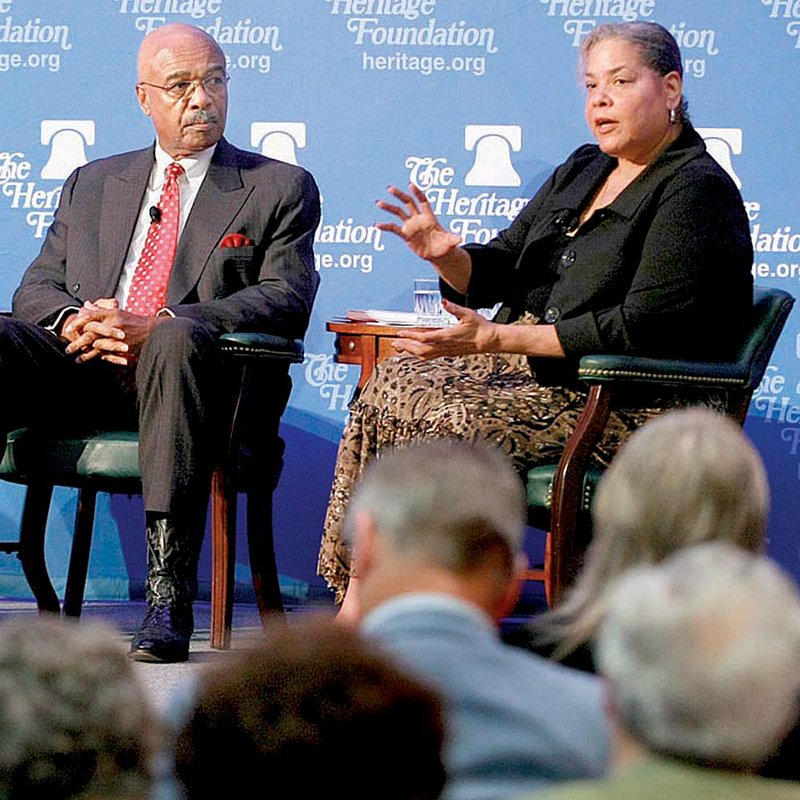 Rod Paige (left), former U.S. education secretary, and Virginia Walden Ford, a fellow at The Heritage Foundation and a former student at Little Rock Central High School, discuss the origins and future of school choice as part of a panel at the Statehouse Convention Center in Little Rock on Monday.