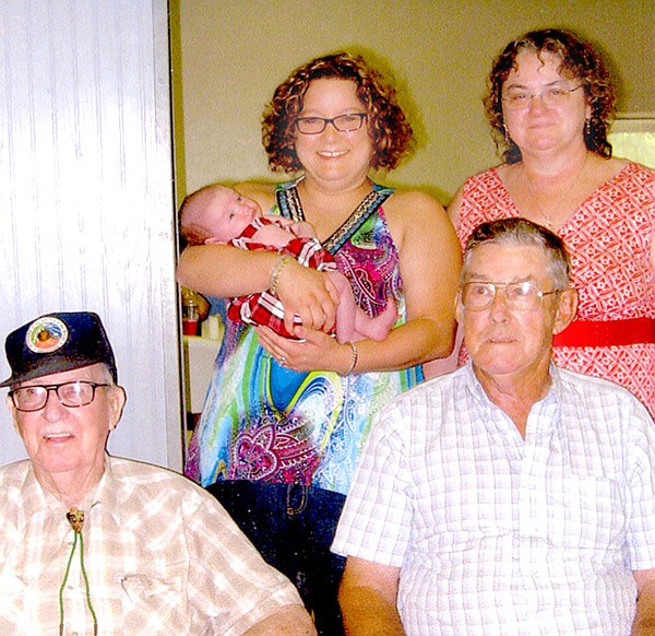 Present for the annual Payne Family reunion at the Gravette picnic are five generations pictured: Seated, from the left, is Delbert O’Neal (brother of Leota Payne) and his nephew Bill Payne. Great-great niece Nikki Mayer is holding Kylee Campbell, great-great-great niece. On the right is great-great niece Paula Nicholson.
