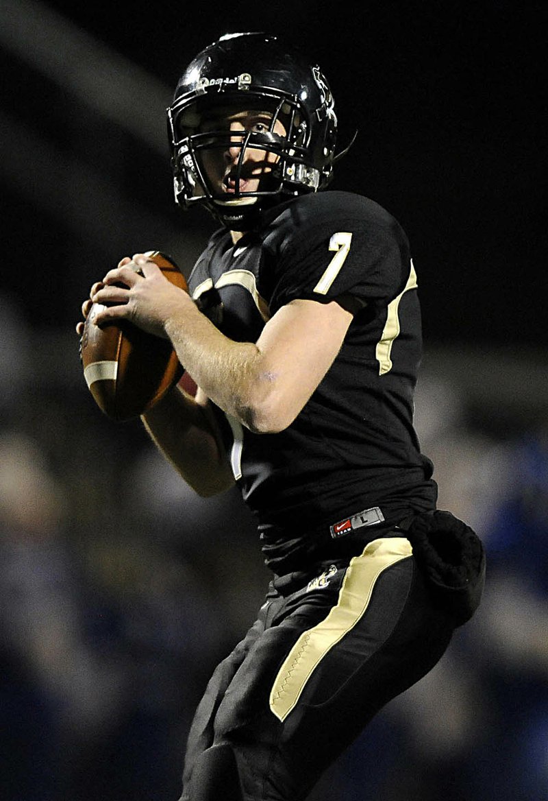  STAFF PHOTO MARC F. HENNING
Bentonville quarterback Dallas Hardison drops back to pass during the Tigers' 7A State Playoff game Friday, Nov. 19, 2010, against Bryant at Tiger Stadium in Bentonville.