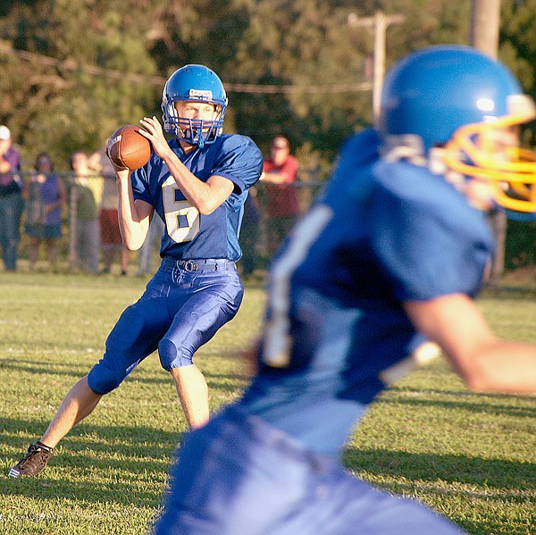 Bulldog quarterback Evan Owens threw a pass during the scrimmage game between Decatur and Berryville on Thursday.
