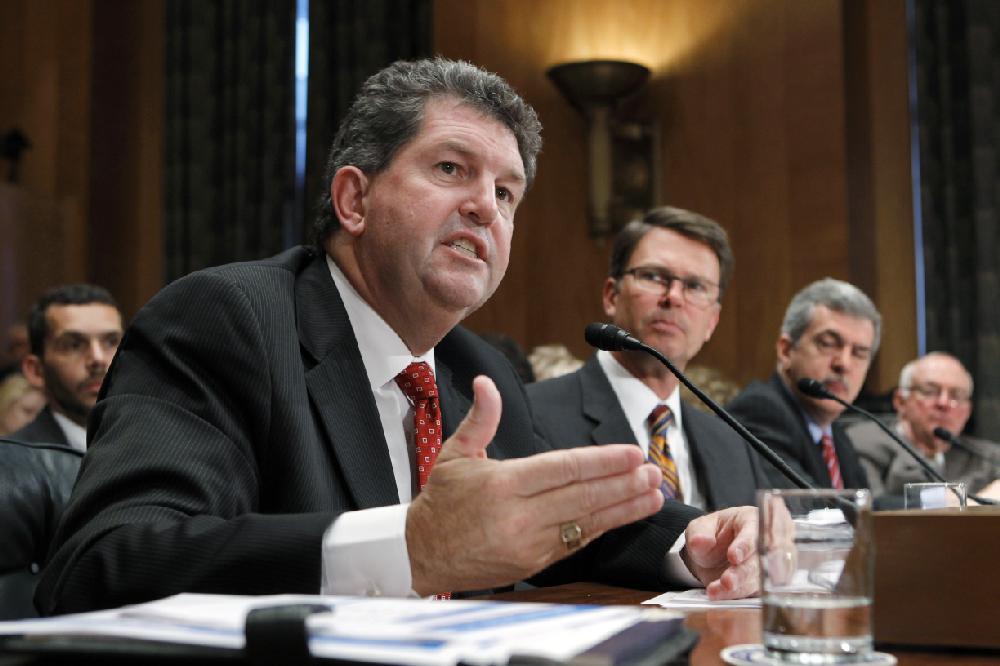 Postmaster General Patrick Donahoe appears before the Senate Homeland Security and Governmental Affairs Committee as the panel examines the economic troubles of the Postal Service, a self-funded federal agency in decline because of the Internet and advertising losses, on Capitol Hill in Washington, Tuesday, Sept. 6, 2011. From left to right are: Donahoe, John Berry, director of the U.S. Office of Personnel Management, Phillip Herr, director of physical infrastructure issues for the Government Accountability Office, and Thomas Levy, chief actuary of The Segal Company, serving as a consultant on postal employee benefits. (AP Photo/J. Scott Applewhite)