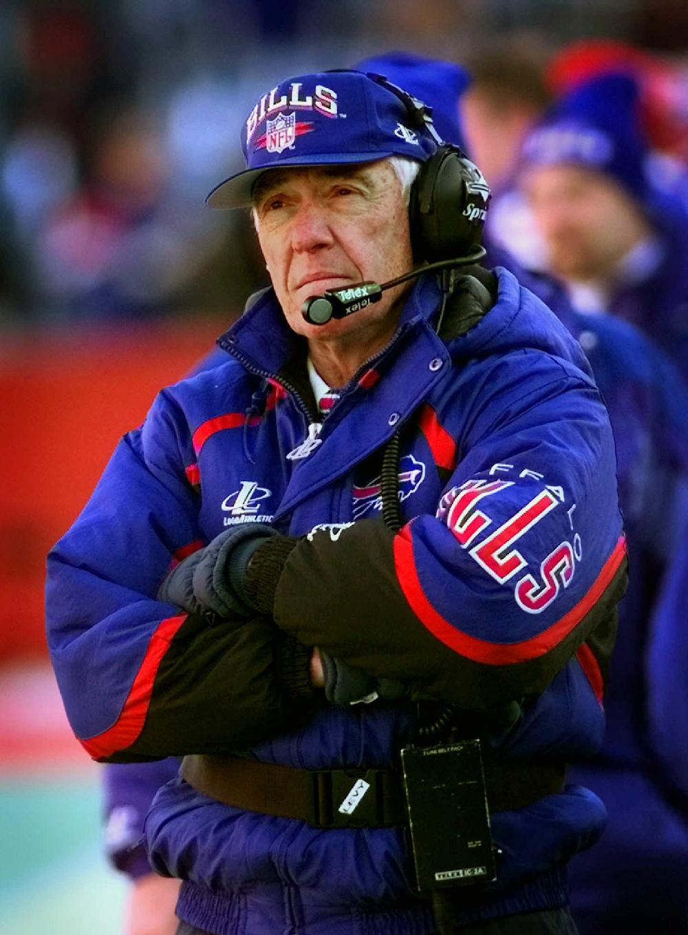 FILE-Buffalo Bills head coach Marv Levy, 72, watches his team in the season's final home game against the Jacksonville Jaguars in this Sunday, Dec. 14, 1997 file photo, at Rich Stadium in Orchard Park, N.Y. The Bills, who called a press conference for Wednesday, Dec. 31, 1997, would not confirm speculation that Levy would step down ending his 12-year stint with the team after taking it to four Super Bowls to start the 1990s. (AP Photo/Bill Sikes, File)