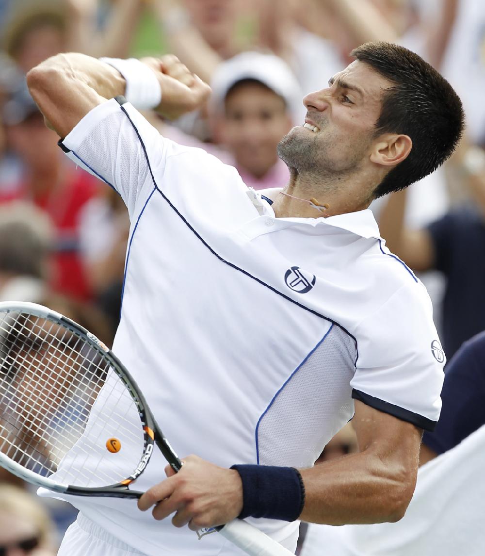 Novak Djokovic of Serbia reacts after winning the first set during his match against Alexandr Dolgopolov of the Ukraine during the U.S. Open tennis tournament in New York, Monday, Sept. 5, 2011. (AP Photo/Paul J. Bereswill)