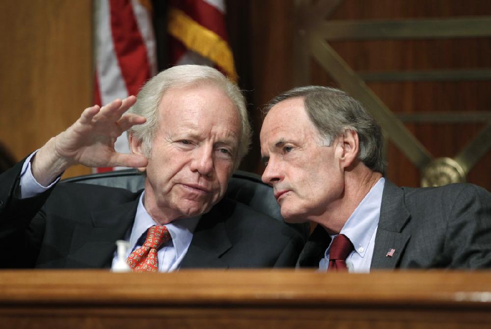During a hearing on the troubles of the U.S. Postal Service, Sen. Joseph I. Lieberman, I-Conn., left, chairman of the Senate Homeland Security and Governmental Affairs Committee, confers with Sen. Tom Carper, D-Del., who chairs the Senate subcommittee that oversees the Postal Service, on Capitol Hill in Washington, Tuesday, Sept. 6, 2011. (AP Photo/J. Scott Applewhite)