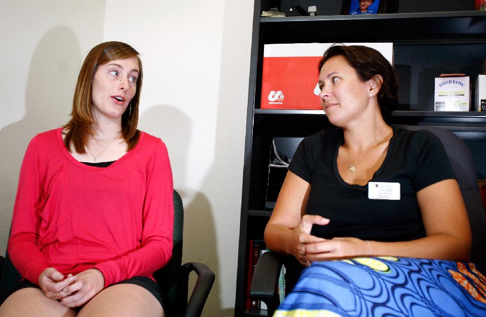 Arkansas Democrat-Gazette/JASON IVESTER --09/06/11--
University of Arkansas senior nursing student Kelly Toner (left) and Cara Osborne, an assistant professor of nursing, speak on Tuesday, Sept. 6, 2011, inside Osborne's office in Ozark Hall on the Fayetteville campus about Midwives for Haiti.