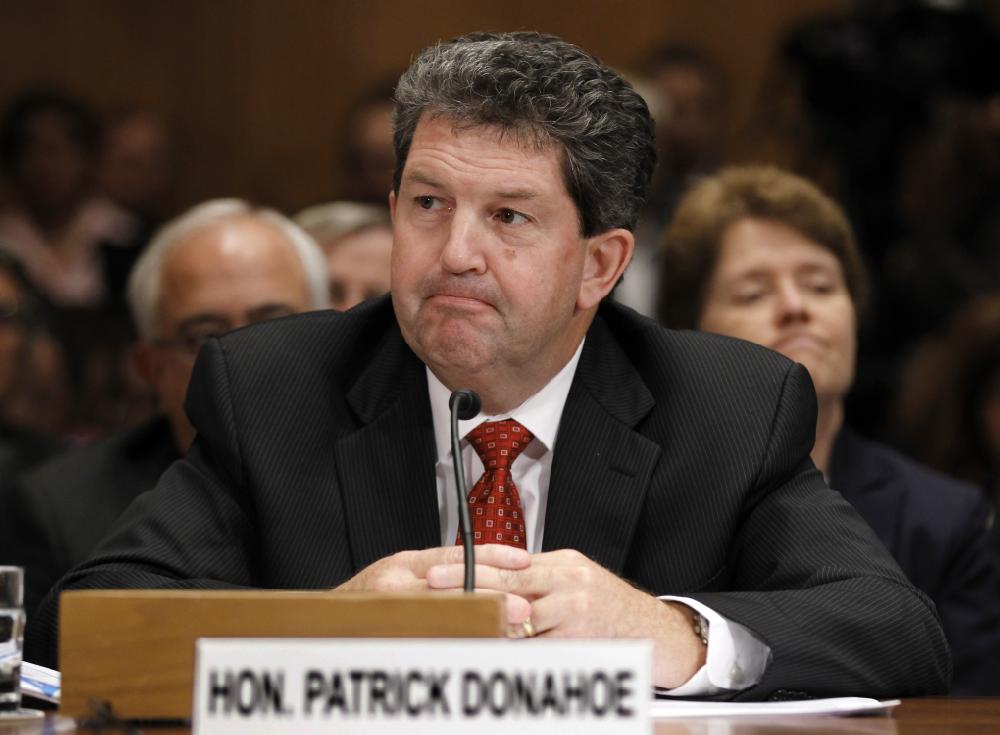 Postmaster General Patrick Donahoe appears before the Senate Homeland Security and Governmental Affairs Committee as the panel examines the economic troubles of the Postal Service, a self-funded federal agency in decline because of the Internet and advertising losses, on Capitol Hill in Washington, Tuesday, Sept. 6, 2011. (AP Photo/J. Scott Applewhite)
