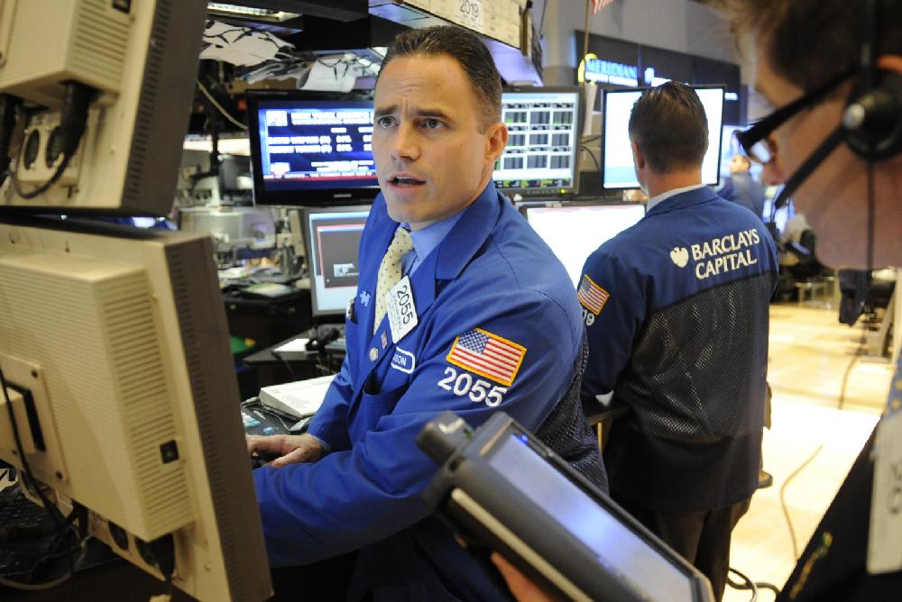 Jason Hardzewicz of Barclays Capital works on the floor of the New York Stock Exchange, Tuesday, Sept. 6, 2011, in New York. (AP Photo/Henny Ray Abrams)