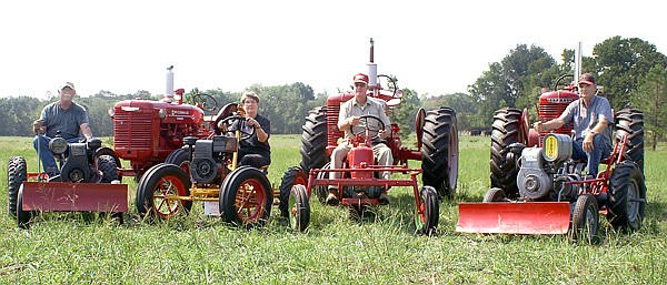 John Burger, Pat Morrison, Glenn Smith and Larry Morrison are getting their tractors and garden tractors ready for the fall show on the grounds of the Tired Iron of the Ozarks in Gentry. This year's show will also host a meeting and showing of the Missouri Regional Garden Tractor Club. The show runs from Friday through Sunday.