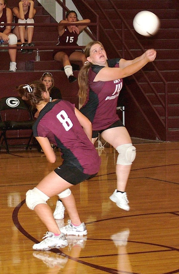 Gentry senior Sarah Tisdale keeps a ball from dropping into the back court in recent play against Lincoln at Gentry High School. Though the girls won all three games against Lincoln, they lost to Southwest City (Mo.) 25-19, 10-25, 13-25, 21-25 on Aug. 29.