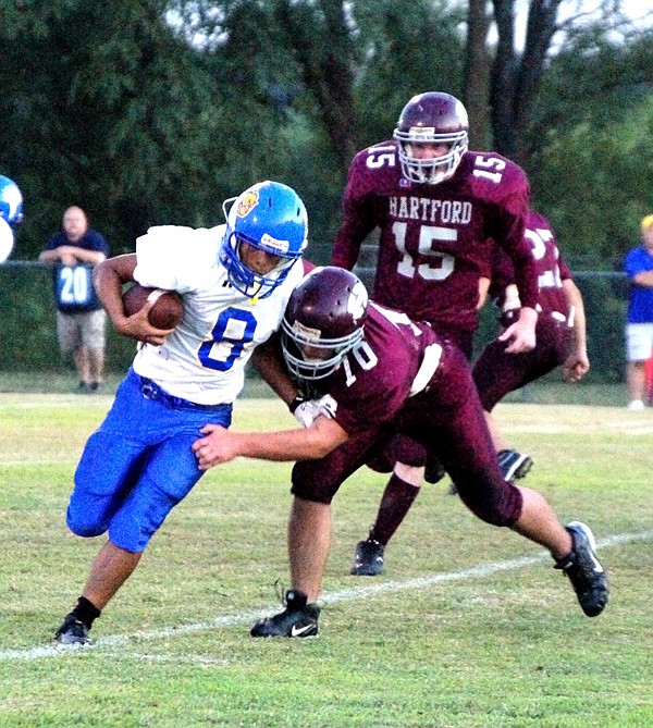 Joe Castaneda slipped through the grasp of a Hartford player during Friday’s game. Castaneda made 16 carries for 80 yards and scored two touchdowns.
