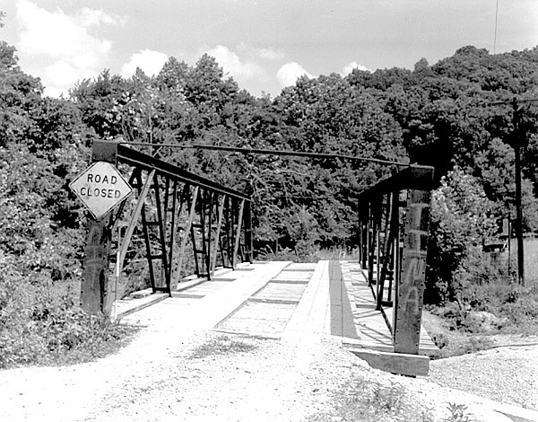 This photo from the Historic American Engineering Record shows the Spavinaw Creek Bridge on Limekiln Road, then known as County Road 29, before it was dismantled.
