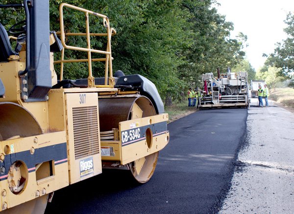 The paving crew of the Benton County Road Department last week completed laying a 2-inch layer of hotmix asphalt on Lime Kiln Road in Gravette.
