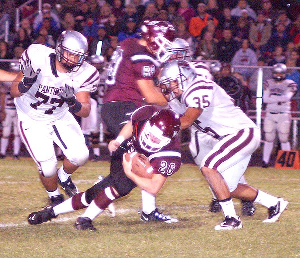 Gentry senior Tanner Coy breaks through the line and picks up a few yards for Gentry on Friday.