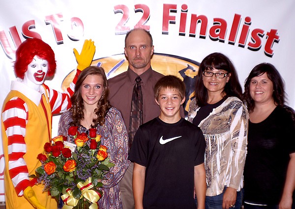 Kaylin Cripps (next to Ronald McDonald), a senior at Gentry High School and an employee of the new McDonalds Restaurant in Gentry, won the McDonalds Greater Southwest Region Voice of McDonalds Singing Contest and was told she had won in a special surprise ceremony at her school on Wednesday (Sept. 21, 2011). Pictured with Kaylin are her father, Eldon Cripps; her mother, Kaye Cripps; her younger brother, Cole Cripps; and her sister, Tahmara Coones.
