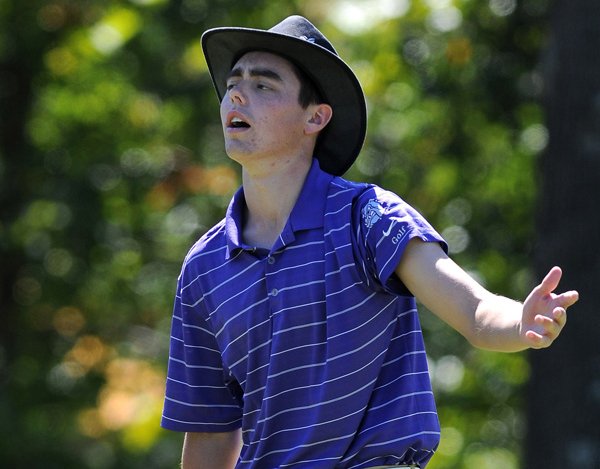 Thatcher Radler of Fayetteville High School reacts to missing a putt on the 14th hole Tuesday during the final round of the 7A State Boys Golf Tournament at the Fayetteville Country Club in Fayetteville. The team portion of the tournament was won by Conway High School and the individual champion for the tournament was Zach Coats of Springdale Har-Ber High School.