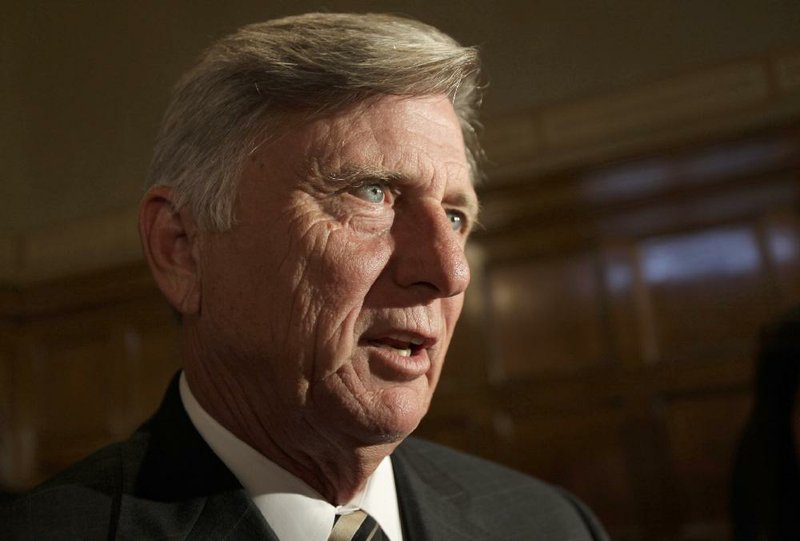 Arkansas Gov. Mike Beebe talks to reporters about state revenues after a news conference in Little Rock, Ark., Tuesday, Aug. 2, 2011. (AP Photo/Danny Johnston)