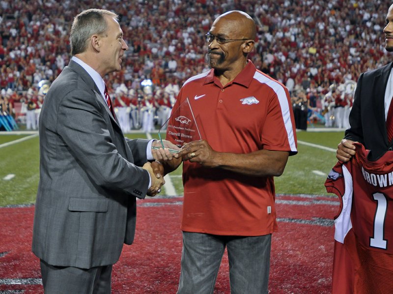 University of Arkansas Athletic Director Jeff Long recognizes Darrell Brown during halftime at the Arkansas-Auburn game on 10/8/11.