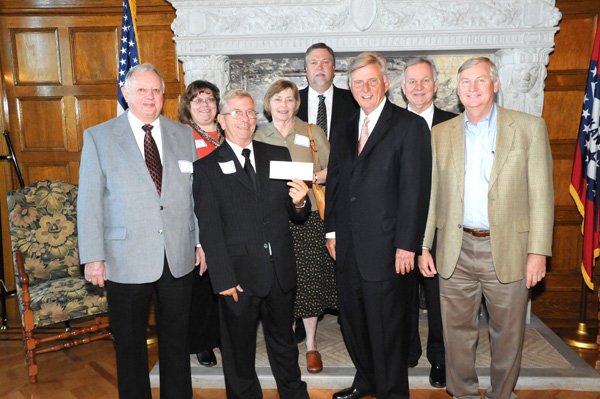 Governor Mike Beebe presented Decatur officials with a check for $3,369.42 on Oct. 5. Pictured, from the left, are Library Board President Dr. Lynval Abercrombie, City Clerk Jeanelle Cox, Mayor Charles Linam, Librarian Karen Jones, ARDC Chair Dennis Donahou, Governor Mike Beebe, DRS Director Butch Calhoun and State Representative Jonathan Barnett. Not pictured are Senator Kim Hendren and Representative Mary Lou Slinkard.
