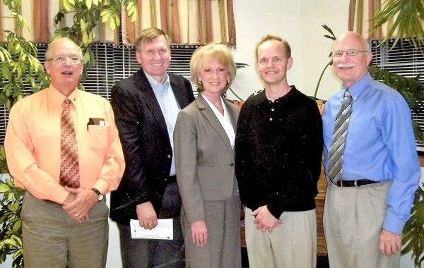 Newly installed officers of the Gravette Kiwanis club are, from the left, Malcolm Winters, treasurer; Jay Oliphant, vice president; Andrea Kelly, president; Bryan Johnson, outgoing president; and Dan Yates, secrertary.
